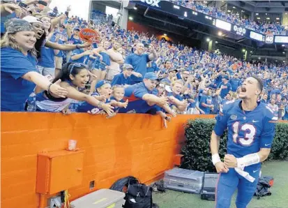  ?? JOHN RAOUX/ASSOCIATED PRESS ?? UF QB Feleipe Franks sent the Swamp into a frenzy after throwing a 63-yard TD pass on the game’s final play to beat Tennessee last season.