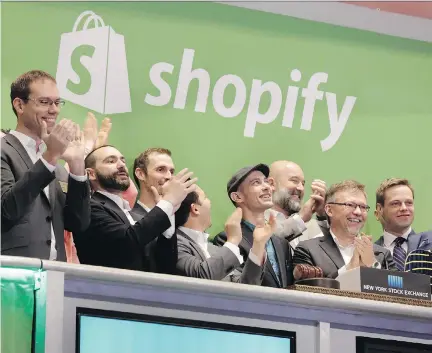  ?? RICHARD DREW/THE ASSOCIATED PRESS FILES ?? Shopify CEO Tobias Lutke, centre wearing hat, rings the New York Stock Exchange opening bell at the Canadian firm’s IPO in 2015. Shopify last week revealed it had signed a lease to triple the amount of space it will occupy in the downtown Ottawa core.