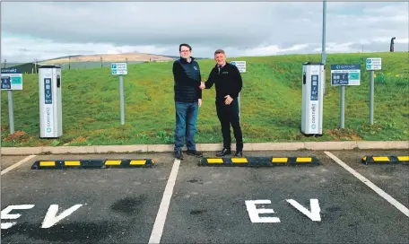  ?? ?? Lagg manager Graham Omand with Connekt EV’s Johnny Manning beside some of the charging points installed at Lagg Distillery.