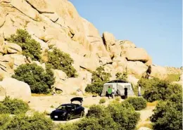  ?? CHRISTOPHE­R REYNOLDS LOS ANGELES TIMES ?? RIGHT: The Hidden Valley Campground, surrounded by dramatic boulders, has 44 sites, pit toilets and no potable water. Camping at Joshua Tree’s Hidden Valley Campground is $15-$20 nightly in winter. Reservatio­ns in cooler months go fast.
