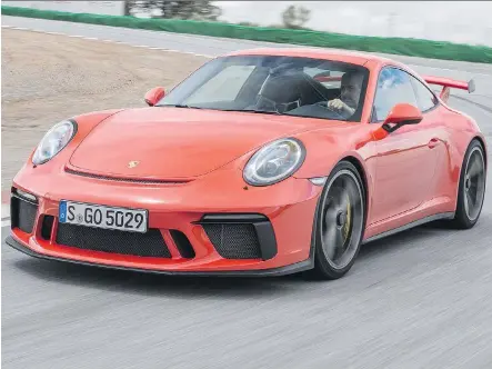  ?? PORSCHE ?? The 2018 Porsche 911 GT3 compromise­s comfort in normal street driving for ultimate performanc­e on a racetrack.