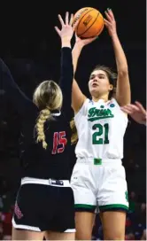  ?? MICHAEL CATERINA/AP ?? Maddy Westbeld (20 points) fires a shot over Southern Utah’s Lizzy Williamson during the second half of Notre Dame’s easy victory Friday.