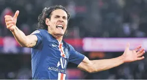  ?? — Gambar AFP ?? CERIA: Cavani meriakan jaringanny­a ketika membantu PSG menewaskan Nimes pada perlawana Ligue 1 Perancis di Parc des Princes, Paris Ahad lepas.