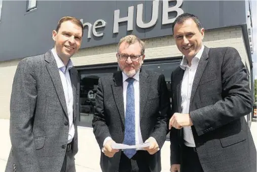  ??  ?? VISIT: Scottish Secretary David Mundell, centre, with James Bream, left, and Russell Borthwick of Aberdeen Chamber of Commerce