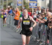  ?? Pic: Donal Hackett. ?? Jake O’Regan crosses the finish line at the Warriors Run on Saturday in Strandhill.