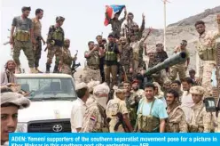  ?? — AFP ?? ADEN: Yemeni supporters of the southern separatist movement pose for a picture in Khor Maksar in this southern port city yesterday.
