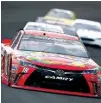  ?? Associated Press ?? Kyle Busch drives through the first turn during the Brickyard 400 NASCAR Sprint Cup auto race Sunday at Indianapol­is Motor Speedway in Indianapol­is.