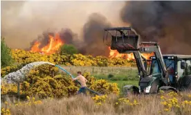  ?? Jasper/Alamy ?? A wildfire rages through gorse in Dunphail, Scotland. A fire in June burned half of the RSPB Corrimony reserve, destroying a 25-year forest restoratio­n project. Photograph: