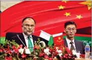  ?? REUTERS ?? Ahsan Iqbal (L), Pakistan’s Minister of Planning and Developmen­t and Yao Jing, Chinese Ambassador to Pakistan attend the launch ceremony of CPEC long-term cooperatio­n plan in Islamabad, Pakistan on 18 December 2017.