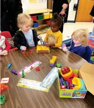  ?? Submitted photo ?? ■ Pre-k students within the Hot Springs School District are shown in their classroom with some of the literacy manipulati­ves provided last fall with grant funding from the Hot Springs Area Community Foundation during one of their required free play portions of the school day. The literacy manipulati­ves focus on and teach early literacy skills while children are interactin­g during free play time. The grants were a part of the HSACF Early Literacy grant cycle.