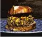 ??  ?? Bem Bom’s lamb burger features grass-fed lamb, a feta compote and an appleginge­r barbecue sauce.