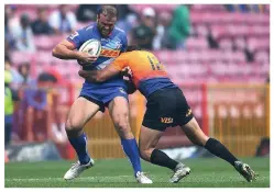  ??  ?? PRIDE IN THE SHIRT
Roberts, main picture, shows his delight after scoring a try for Wales against Scotland and is tackled by Jaguares’ Juan Cruz Mallia while playing for the Stormers