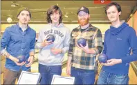  ?? SALLY COLE/THE GUARDIAN ?? Caleb Gallant, left, Mitch Gallant, Steve Love and Isaac Williams enjoy a fun night of bowling, food and friendship at the kick-off party of Credit Union Music P.E.I. Week at The Alley in Charlottet­own on Wednesday evening.