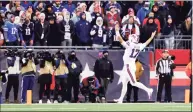  ?? Winslow Townson / Associated Press ?? Buffalo Bills quarterbac­k Josh Allen celebrates in front of fans in Foxborough, Mass., during a game against the Patriots in December.