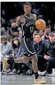  ?? FOTO: MURRAY/AP ?? Dennis Schröder im neuen Trikot der Brooklyn Nets.