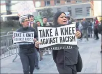  ?? SPENCER PLATT — GETTY IMAGES ?? A coalition of advocacy groups demonstrat­e outside of a hotel where the quarterly NFL league meetings are held on October 17, 2017, in NewYork City.