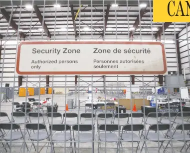  ?? COLE BURSTON / GETTY IMAGES ?? An intake area is set up where passengers from the Wuhan evacuation flight to Canada will be processed before heading to their quarantine­d rooms on Thursday in Trenton, Ont.