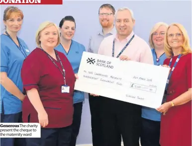  ??  ?? Generous The charity present the cheque to the maternity ward