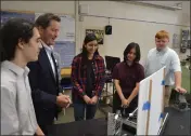  ?? PHOTOS BY NICK SESTANOVIC­H — THE REPORTER ?? Above: Rep. John Garamendi, second from left, views the first-place Travis Spark Challenge project designed by Will C. Wood aviation students, from Garamendi's left to right, Rogelio Meza, Alison Schonauer, Melissa Schonauer and Cody Evans. Below: Garamendi, right, speaks with, left to right, Will C. Wood High School seniors Scott Rawlins, Luciouse Simi and Hayden Hawkins, part of the first-prize winning team in the fuel savings category.