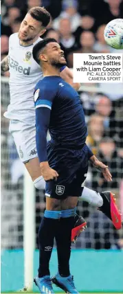  ??  ?? Town’s Steve Mounie battles with Liam Cooper PIC: ALEX DODD/ CAMERA SPORT