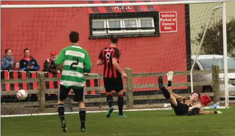  ??  ?? David Behan of Gorey Rangers hits the back of the net against Gorey Celtic in the FAI Junior Cup.