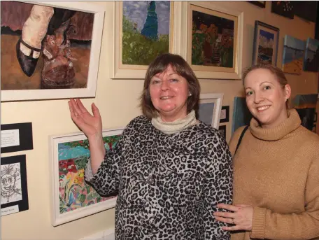  ??  ?? In attendance at the launch of the Carnew Community Art Group exhibition in Carnew Community Care was exhibiting artist, Bridget Roche with Claire McGuinness.