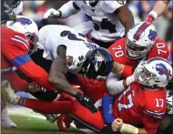  ?? ADRIAN KRAUS ?? Buffalo Bills quarterbac­k Josh Allen (17) has the ball knocked loose as he is hit by Baltimore Ravens outside linebacker Matt Judon (99), right, during the first half of an NFL football game in Orchard Park, N.Y., Sunday, Dec. 8, 2019. The fumble was recovered by Ravens defensive end Jihad Ward (53).