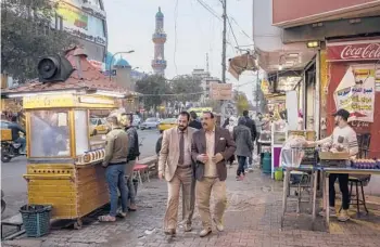  ?? IVOR PRICKETT/THE NEW YORK TIMES ?? In Iraq’s capital city, many believe they enjoy a herd immunity from COVID-19, which has infected almost 100 million people and killed more than 2 million worldwide. Above, a busy street Jan. 17 in Baghdad.