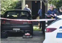  ?? PHOTO: GREGOR RICHARDSON ?? At the scene . . . Dunedin police investigat­e a serious assault in North East Valley, Dunedin, yesterday.