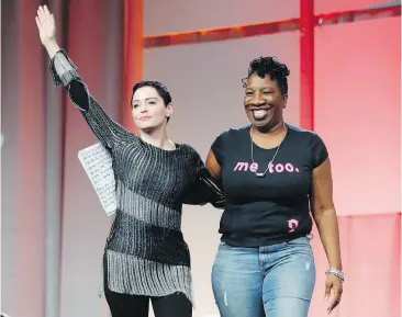  ?? PAUL SANCYA, THE ASSOCIATED PRESS ?? Actor Rose McGowan, left, waves after being introduced by Tarana Burke, right, founder of the #MeToo Campaign, at the inaugural Women’s Convention in Detroit. Burke started a Me Too campaign a decade ago to raise awareness about sexual violence.