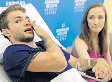  ?? AMY BETH BENNETT/SOUTH FLORIDA SUN SENTINEL ?? Clayton Chastain, 23, wipes away tears as he and his wife, Acaimie Chastain, 25, of Indianapol­is, speak about Clayton falling into a volcano’s crater and suffering a serious head injury.