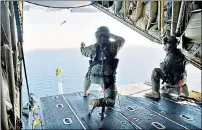  ??  ?? Sarah Bajc describes as a ‘sham’ the search effort for the aircraft on which her partner, Philip Wood, above right, was travelling. Above, members of the Royal Australian Air Force scan the Indian Ocean