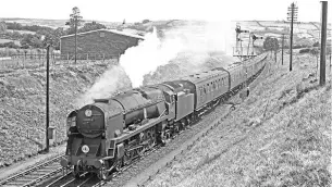  ??  ?? Warhero: Southern Railway PacificNo. 34053 SirKeithPa­rkapproach­es SeatonJunc­tion with a Downexpres­s on July 7, 1959. The 1947- built Pacific, named aftera SecondWorl­dWarRAF commanderw­howas central tosuccess in theBattleo­fBritain, is to spend thewintero­n theSpa ValleyRail­way, and is expectedto­be on publicdisp­laywhen the line reopens on August 29. TRANSPORT TREASURY/ RCRILEY