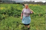  ?? PAULA VAZQUEZ—THE ASSOCIATED PRESS ?? Dolores Leis stands in a field on her farm in Galicia, Spain, on April 19, 2018.