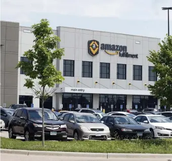  ?? AP PHOTOS ?? PACKAGE OF GRIEVANCES: Workers at an Amazon warehouse in Shakopee, Minn., plan to strike Monday during ‘Prime Day,’ seeking better pay and working conditions.