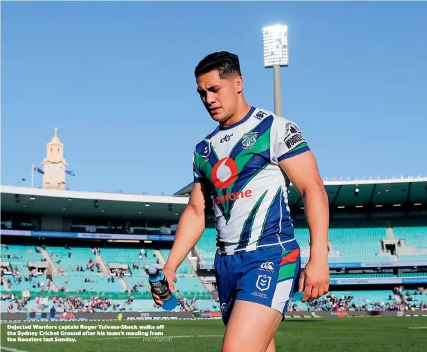  ?? PHOTOSPORT ?? Dejected Warriors captain Roger Tuivasa-Sheck walks off the Sydney Cricket Ground after his team’s mauling from the Roosters last Sunday.