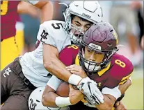  ?? ROB DICKER/DAILY SOUTHTOWN ?? Mount Carmel’s Matt Lenti wraps up Loyola’s Trevor Cabanban on Saturday in Loyola’s first loss to a Catholic League team since 2014.