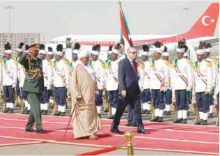  ?? — AFP ?? Turkish President Recep Tayyip Erdogan (C-R) is welcomed by his Sudanese counterpar­t Omar al-Bashir (C-L) upon his arrival in Khartoum on Sunday for a two-day-official visit.