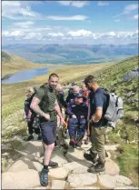  ?? Photograph: JAPES. ?? A team of family, friends and volunteers helped get David MacPherson up Ben Nevis. Now he wants to reward Campbeltow­n’s community carers.