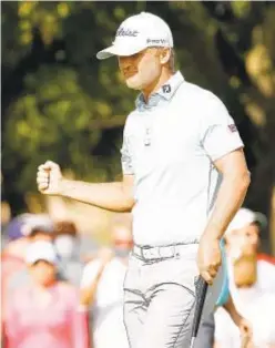  ?? GETTY ?? Matt Jones sinks putt on 12th green during final round Sunday.