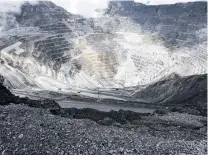  ?? PHOTO: REUTERS ?? Trucks operate in the openpit mine of PT Freeport’s Grasberg copper and gold mine complex near Timika, in the eastern region of Papua, Indonesia.