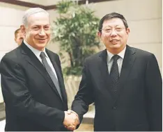  ??  ?? DIPLOMATIC TIES: Israel’s Prime Minister Benjamin Netanyahu shakes hands with Shanghai’s Mayor Yang Xiong in Shanghai. — Reuters photo