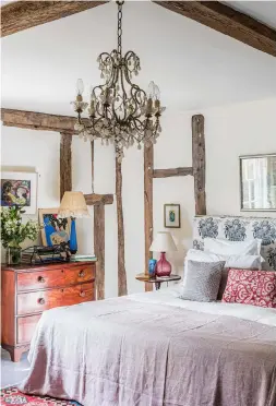  ??  ?? MASTER BEDROOM A subtle blend of colours and textures suffuses this space with a delightful sense of calm.
Bedspread, price on request, Sophie Grattan Bellew Interiors. Similar chandelier, £650, The Boule-in