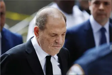  ?? AP PHOTO BY MARK LENNIHAN ?? In this Aug. 26, 2019, photo, Harvey Weinstein arrives in court in New York. A new book by The New York Times reporters who uncovered sexual misconduct accusation­s against Weinstein includes new details on the movie mogul’s attempts to stop the newspaper from publishing the story.