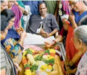  ?? — DC ?? Family members mourn near the body of Sivajyothi, a Uppal resident who died in the tragedy, on Tuesday.