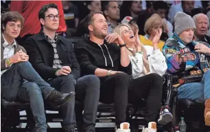  ?? AP ?? Los Angeles Rams quarterbac­k Matthew Stafford, third from left, and his wife, Kelly, watch the Los Angeles Lakers take on Golden State on March 5.