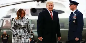  ?? AP/JACQUELYN MARTIN ?? President Donald Trump and first lady Melania Trump board Air Force One on Friday at Andrews Air Force Base in Maryland as they head to Paris, where they will participat­e in World War I commemorat­ions.