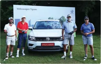  ??  ?? Col Manbir Hundal, Ramesh Krishan, Ajay Taj Singh & Shalini Pradhan with the New Volkswagen Tiguan