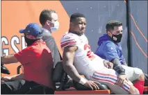  ??  ?? Giants running back Saquon Barkley went down with a season-ending torn ACL during his team’s 17-13loss to the Bears on Sunday.
NAM Y. HUH — THE ASSOCIATED PRESS