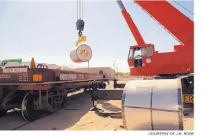  ?? COURTESY OF J.H. ROSE ?? Internatio­nal shipping company J.H. Rose Logistics loads rolls of steel for transport to Mexico at its facility in Santa Teresa.